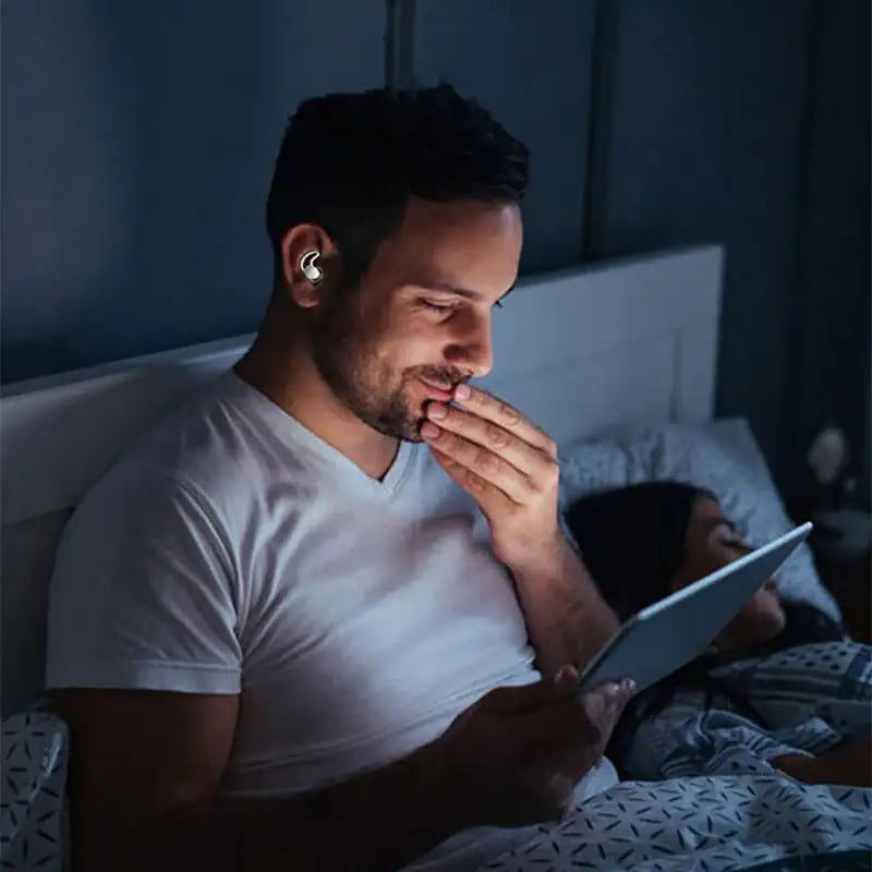 Off Hours Earplugs shown in the ear, sitting flush enough to wear under a mask strap